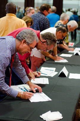 attendees signing in at the March 2012 public hearing
